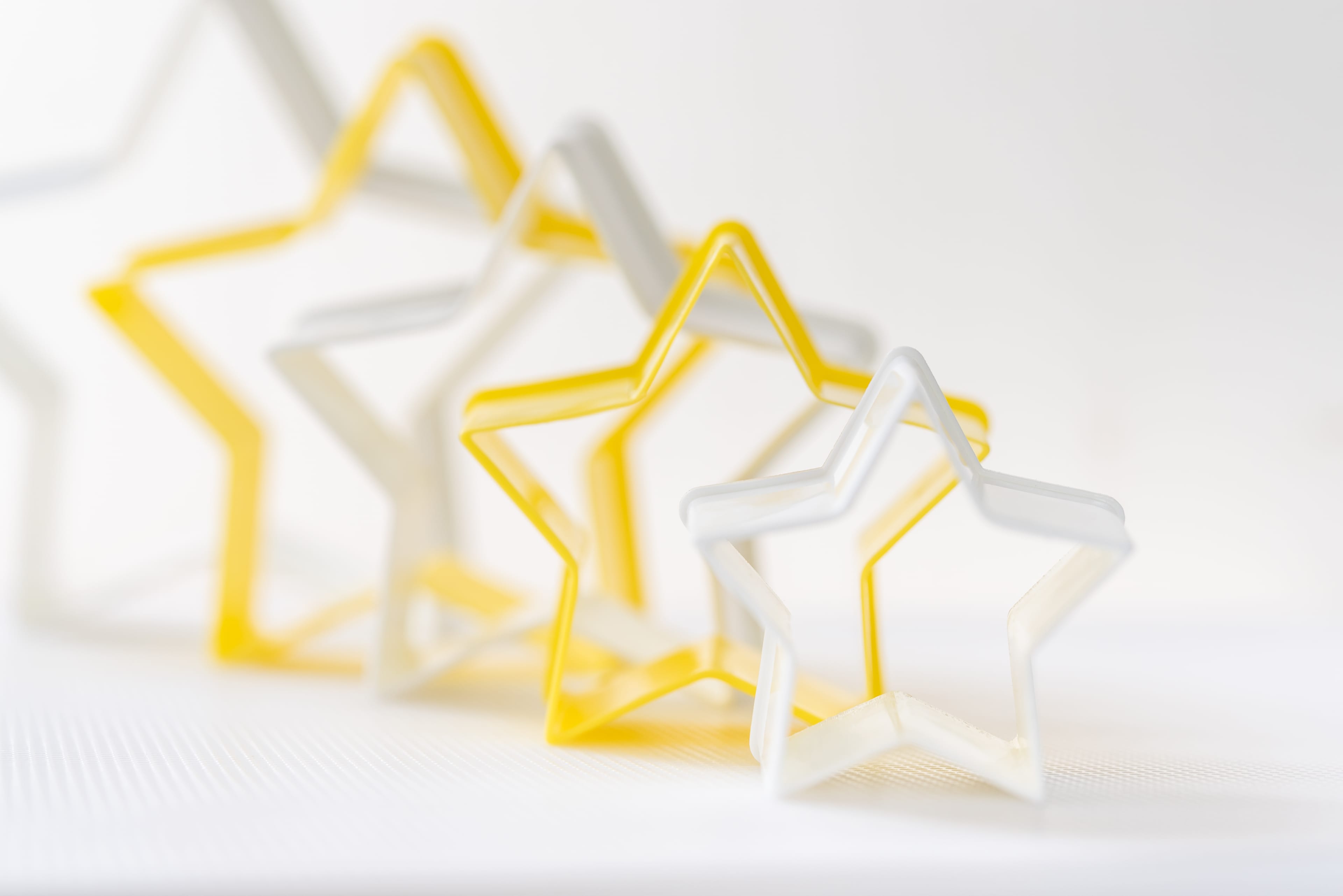 Close up star shaped pastry cutter on a white background