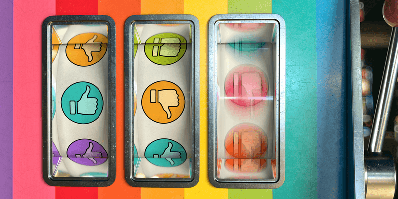 Slot machine / one arm bandit with thumbs up and down as like and dislike icons on the three spinning wheels. Two wheels are stationary and the third is still spinning with motion blur. The machine has signs of wear and tear. The icons are a mixtures of pastel colours.