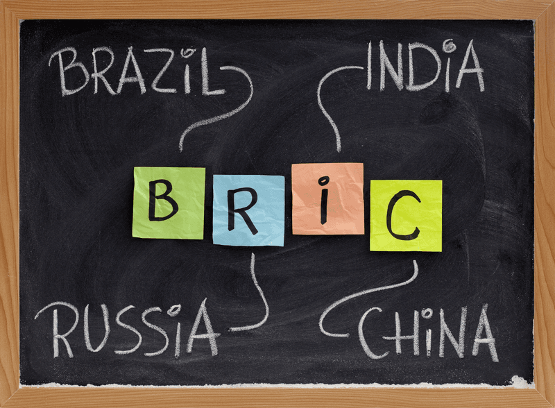 BRIC (Brazil, Russia, India, China) acronym - emerging markets or new economies, white chalk handwriting, colorful sticky notes on blackboard